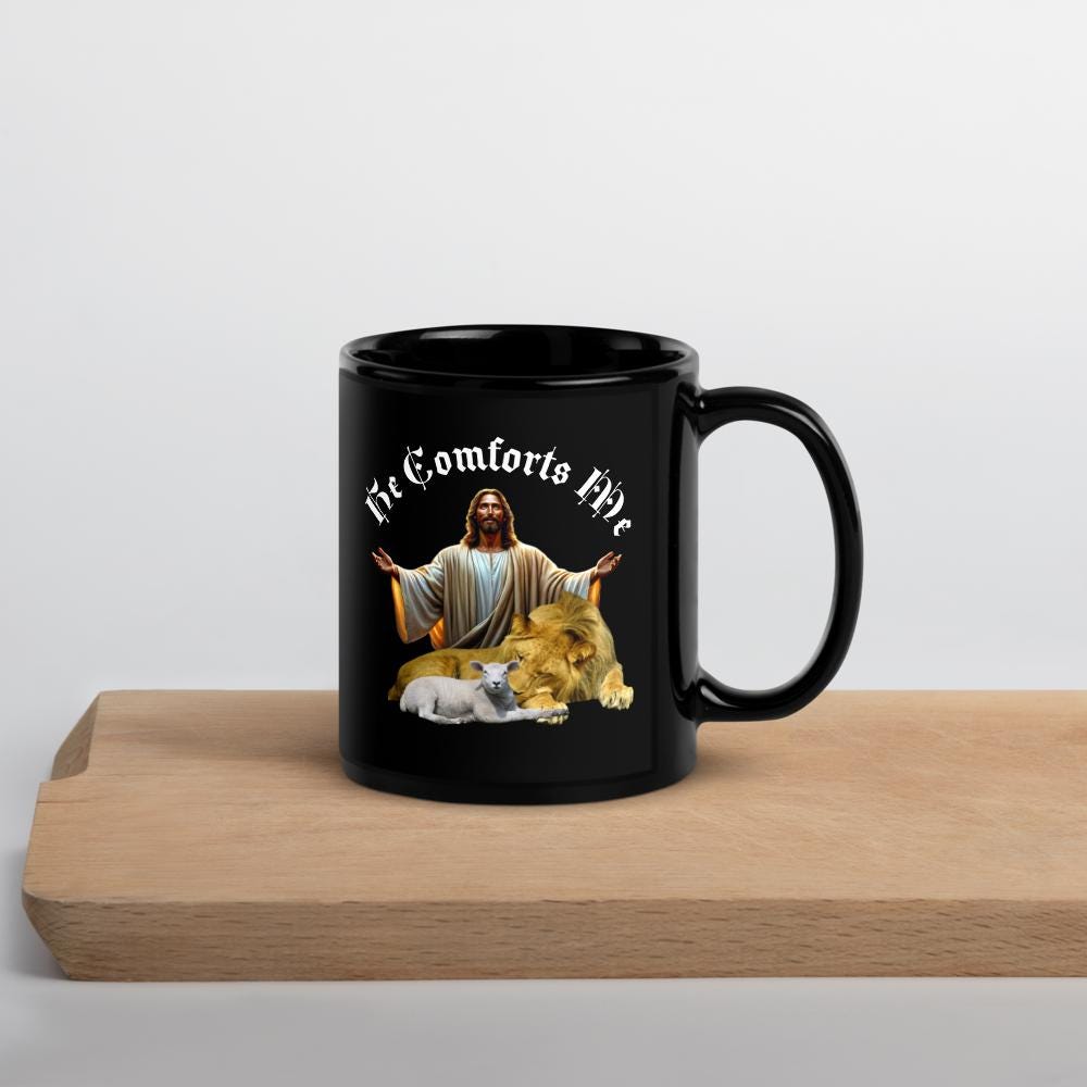 "He Comforts Me" Lion & Lamb Black Glossy Mug – 11 oz | Christian Faith Gift